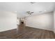 Spacious living room featuring wood-look floors, a ceiling fan and fresh paint at 105 E Hermosa Dr, Tempe, AZ 85282