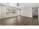 Bright living room with wood-look floors, a ceiling fan and lots of natural light at 105 E Hermosa Dr, Tempe, AZ 85282