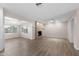 Bright living room with wood-look floors, an electric fireplace, and plenty of space at 105 E Hermosa Dr, Tempe, AZ 85282