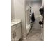 Bathroom with a shower and tub combo, black and white shower curtain and convenient towel storage at 1055 N 86Th Pl, Scottsdale, AZ 85257