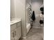 Bathroom with a shower and tub combo, black and white shower curtain and convenient towel storage at 1055 N 86Th Pl, Scottsdale, AZ 85257