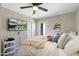 Comfortable bedroom with TV, closet, and soft, inviting textures for relaxation at 1055 N 86Th Pl, Scottsdale, AZ 85257