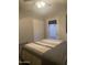 Bedroom with ceiling fan, striped bedding, closet, and exterior door leading to the backyard at 1055 N 86Th Pl, Scottsdale, AZ 85257