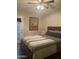 Comfortable bedroom featuring a ceiling fan and a sliding door with access to outdoor area at 1055 N 86Th Pl, Scottsdale, AZ 85257