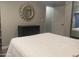 Bedroom featuring a large mirror, dark dresser, and white bedspread at 1055 N 86Th Pl, Scottsdale, AZ 85257