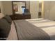 Inviting bedroom with a vintage dresser, natural light, and a comfortable bed at 1055 N 86Th Pl, Scottsdale, AZ 85257
