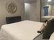 Comfortable bedroom featuring a stylish mirror, a spacious bed, and modern decor at 1055 N 86Th Pl, Scottsdale, AZ 85257