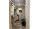 Walk-in closet with custom wood-slat shelving and modern flooring, providing ample storage space at 1055 N 86Th Pl, Scottsdale, AZ 85257