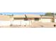 Tan single-story home with a two car garage and well maintained front yard landscaping at 1055 N 86Th Pl, Scottsdale, AZ 85257
