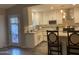 Bright kitchen with white cabinetry, stainless steel appliances, and breakfast bar at 1055 N 86Th Pl, Scottsdale, AZ 85257