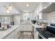 Modern kitchen equipped with white cabinets, subway tile backsplash, and stainless steel appliances at 1055 N 86Th Pl, Scottsdale, AZ 85257