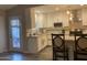 Bright kitchen featuring white cabinets, stainless steel appliances, and breakfast bar seating, perfect for gatherings at 1055 N 86Th Pl, Scottsdale, AZ 85257