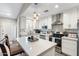 Modern kitchen featuring white cabinetry, a center island, and stainless steel appliances at 1055 N 86Th Pl, Scottsdale, AZ 85257