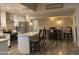 Modern kitchen with stainless steel appliances, a large island, and cozy dining area at 1055 N 86Th Pl, Scottsdale, AZ 85257