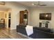 Neutral living room features recessed lighting, ceiling fan, modern TV, and comfortable furniture at 1055 N 86Th Pl, Scottsdale, AZ 85257