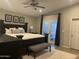Well-appointed main bedroom with a comfortable bed, elegant decor, and private balcony access at 1055 N 86Th Pl, Scottsdale, AZ 85257