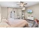 Main bedroom featuring french doors, a TV, and a stylish zebra rug for added flair at 1055 N 86Th Pl, Scottsdale, AZ 85257
