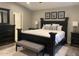 Elegant main bedroom with dark wood furniture, plush carpeting, and ample natural light creating a relaxing retreat at 1055 N 86Th Pl, Scottsdale, AZ 85257