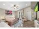 Stylish main bedroom with vaulted ceilings, french doors, a chic desk, and trendy zebra rug at 1055 N 86Th Pl, Scottsdale, AZ 85257