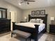 Spacious main bedroom with a large bed, stylish furniture, and ample natural light at 1055 N 86Th Pl, Scottsdale, AZ 85257