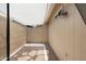 Cozy outdoor patio area, shaded with decorative rock and paver details at 1055 N 86Th Pl, Scottsdale, AZ 85257