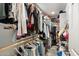 Walk-in closet with built-in shelving and ample storage space for organizing clothes and accessories at 1055 N 86Th Pl, Scottsdale, AZ 85257