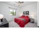 Bedroom with a ceiling fan, modern decor, and a large window at 1124 E Rose Ln # 17, Phoenix, AZ 85014