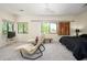 Spacious bedroom features plush carpeting, ceiling fan, sitting area and windows that let in lots of natural light at 1124 E Rose Ln # 17, Phoenix, AZ 85014