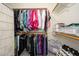 Walk in closet has ample storage with clothing racks, shelves, and room for shoes at 1124 E Rose Ln # 17, Phoenix, AZ 85014