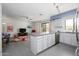 Modern kitchen with updated appliances, ample counter space, and adjacent living area at 1124 E Rose Ln # 17, Phoenix, AZ 85014