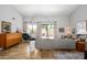 Stylish living room boasts travertine floors, modern furnishings, and natural light at 1124 E Rose Ln # 17, Phoenix, AZ 85014