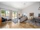 Open living room with high ceilings, tile floors, and sliding glass doors to the patio at 1124 E Rose Ln # 17, Phoenix, AZ 85014