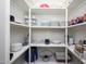 Organized pantry shelving provides ample storage for kitchen essentials at 1124 E Rose Ln # 17, Phoenix, AZ 85014