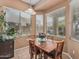 Bright breakfast nook with bay windows offering scenic views, perfect for enjoying morning meals at 12417 W Apache St, Avondale, AZ 85323