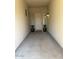 Inviting entryway with potted plants and a light fixture at 12417 W Apache St, Avondale, AZ 85323