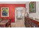 Welcoming entryway featuring tile floors, a red accent wall, and decorative furniture for a grand entrance at 12417 W Apache St, Avondale, AZ 85323