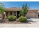 Charming single-story home with well-manicured desert landscaping and a two-car garage at 12417 W Apache St, Avondale, AZ 85323