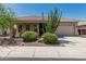 Charming single-story home with well-manicured desert landscaping and a two-car garage at 12417 W Apache St, Avondale, AZ 85323