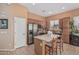 Well-equipped kitchen with stainless steel appliances, island seating, and a window over the sink at 12417 W Apache St, Avondale, AZ 85323