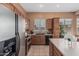 Functional kitchen features stainless steel appliances, ample counter space, and wooden cabinetry at 12417 W Apache St, Avondale, AZ 85323