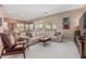 Bright living room features neutral paint, plush carpet, and comfortable seating area for relaxation and entertainment at 12417 W Apache St, Avondale, AZ 85323
