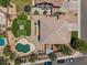 Birds eye view showcasing backyard oasis with pool, putting green, and a trampoline at 1250 E Canyon Creek Dr, Gilbert, AZ 85295