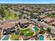Expansive aerial view of a neighborhood featuring homes with pools and well-manicured landscaping at 1250 E Canyon Creek Dr, Gilbert, AZ 85295
