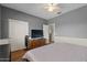 Comfortable bedroom with wood floors, closet, and light-colored walls, perfect for relaxation at 1250 E Canyon Creek Dr, Gilbert, AZ 85295