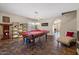 Spacious game room featuring a pool table and view to the entry hall, complete with stylish decor and furnishings at 1250 E Canyon Creek Dr, Gilbert, AZ 85295