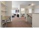 Open hallway leading to a living area with desk and laundry room at 1250 E Canyon Creek Dr, Gilbert, AZ 85295