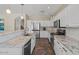 Bright kitchen boasts stainless steel appliances, granite countertops, and white subway tile backsplash at 1250 E Canyon Creek Dr, Gilbert, AZ 85295