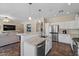 Bright kitchen boasts stainless steel appliances, granite countertops, and a stylish tile backsplash at 1250 E Canyon Creek Dr, Gilbert, AZ 85295