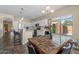 Open concept kitchen with dining area features granite countertops and stainless steel appliances at 1250 E Canyon Creek Dr, Gilbert, AZ 85295
