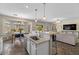 Open kitchen with a breakfast bar and a seamless connection to the living and dining areas, perfect for entertaining at 1250 E Canyon Creek Dr, Gilbert, AZ 85295